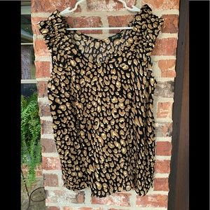 Cute silky sleeveless top with ruffle detail on shoulders.